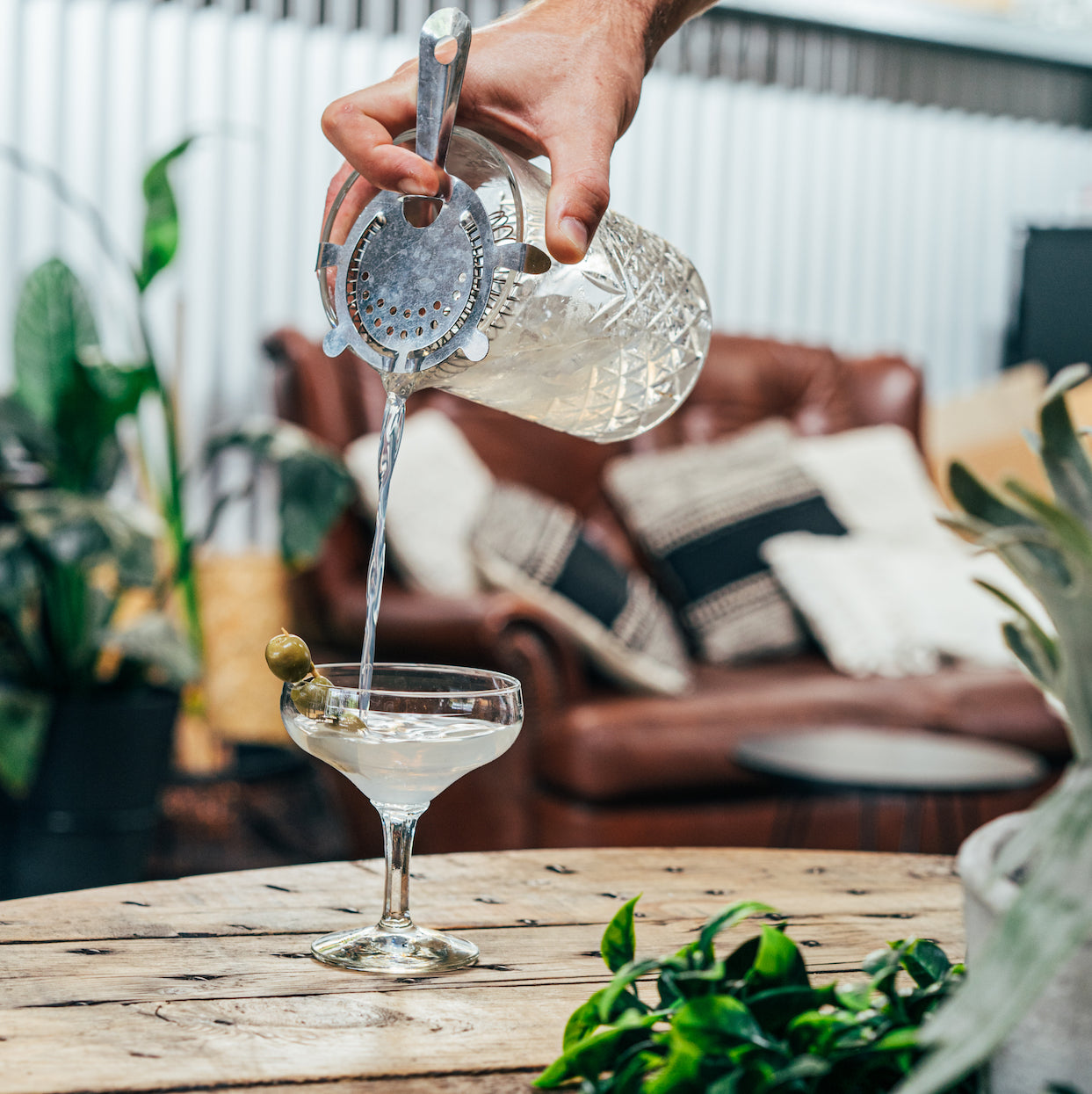 Pouring a dry martini within the distillery